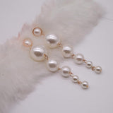 Long artificial pearls earrings